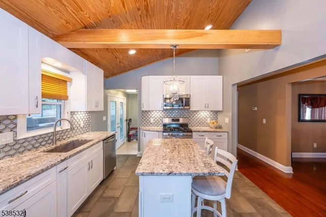 a kitchen with a table and chairs in it