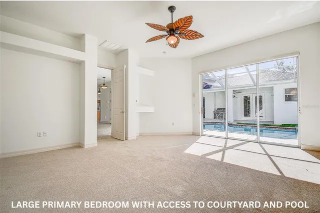 a large bathroom with a sink a vanity and a large mirror