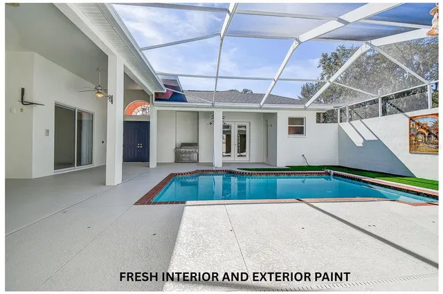 a view of an house with swimming pool and porch