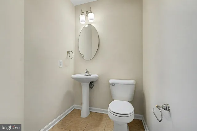 a bathroom with a toilet and a sink