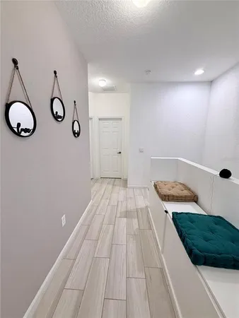 a view of a room with wooden floor and window