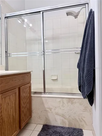 a bathroom with a shower and a sink