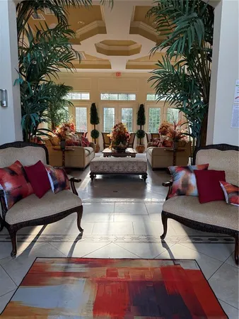 a view of a swimming pool with seating space