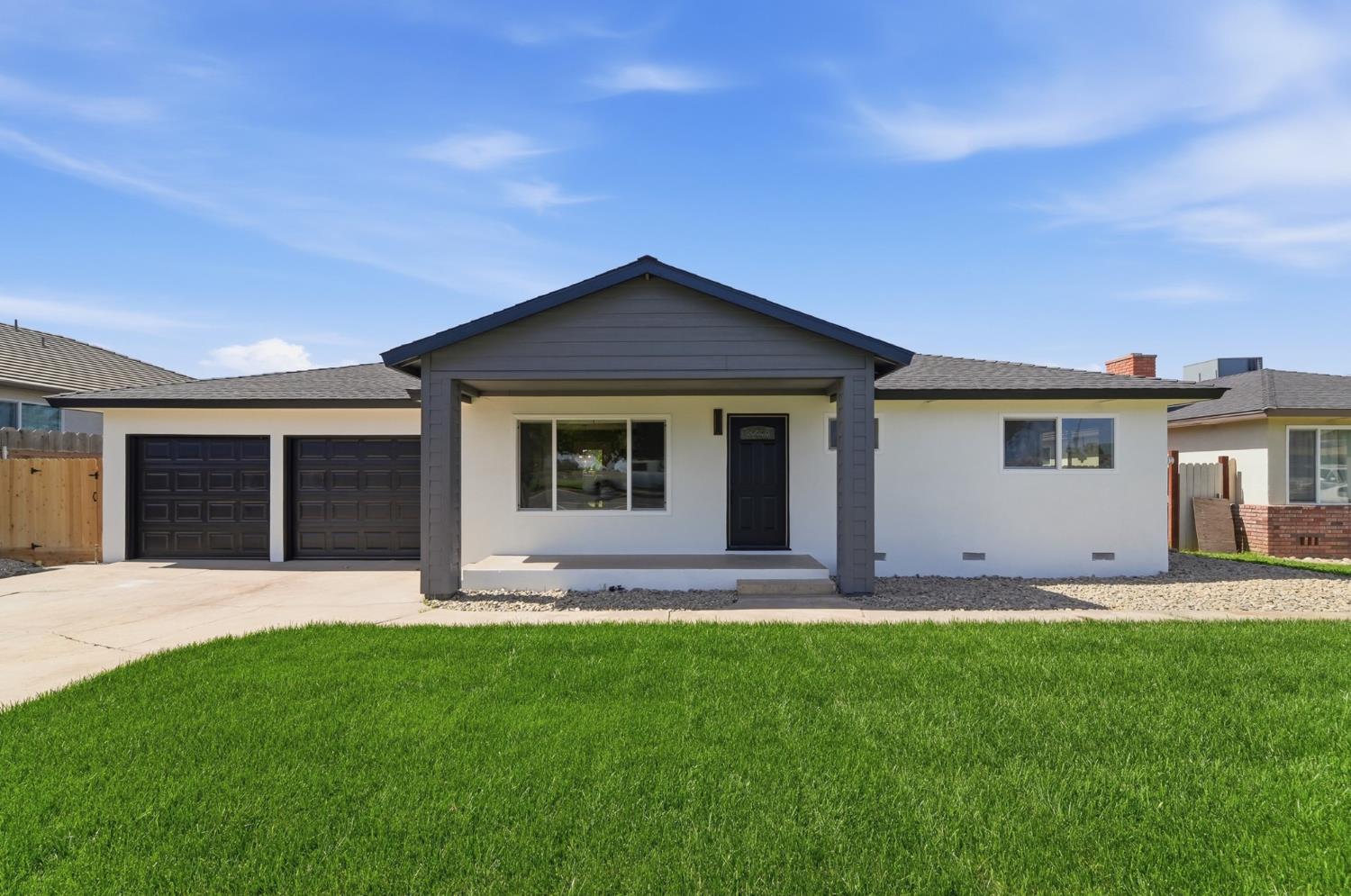 6237 Claus Road Riverbank, CA 95367 - Photo 1 of 53 a front view of a house with a garden and yard