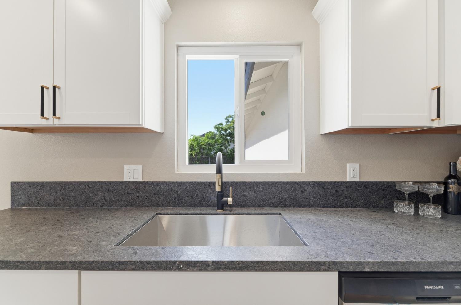 6237 Claus Road Riverbank, CA 95367 - Photo 16 of 53 a kitchen with granite countertop a sink and a granite counter tops