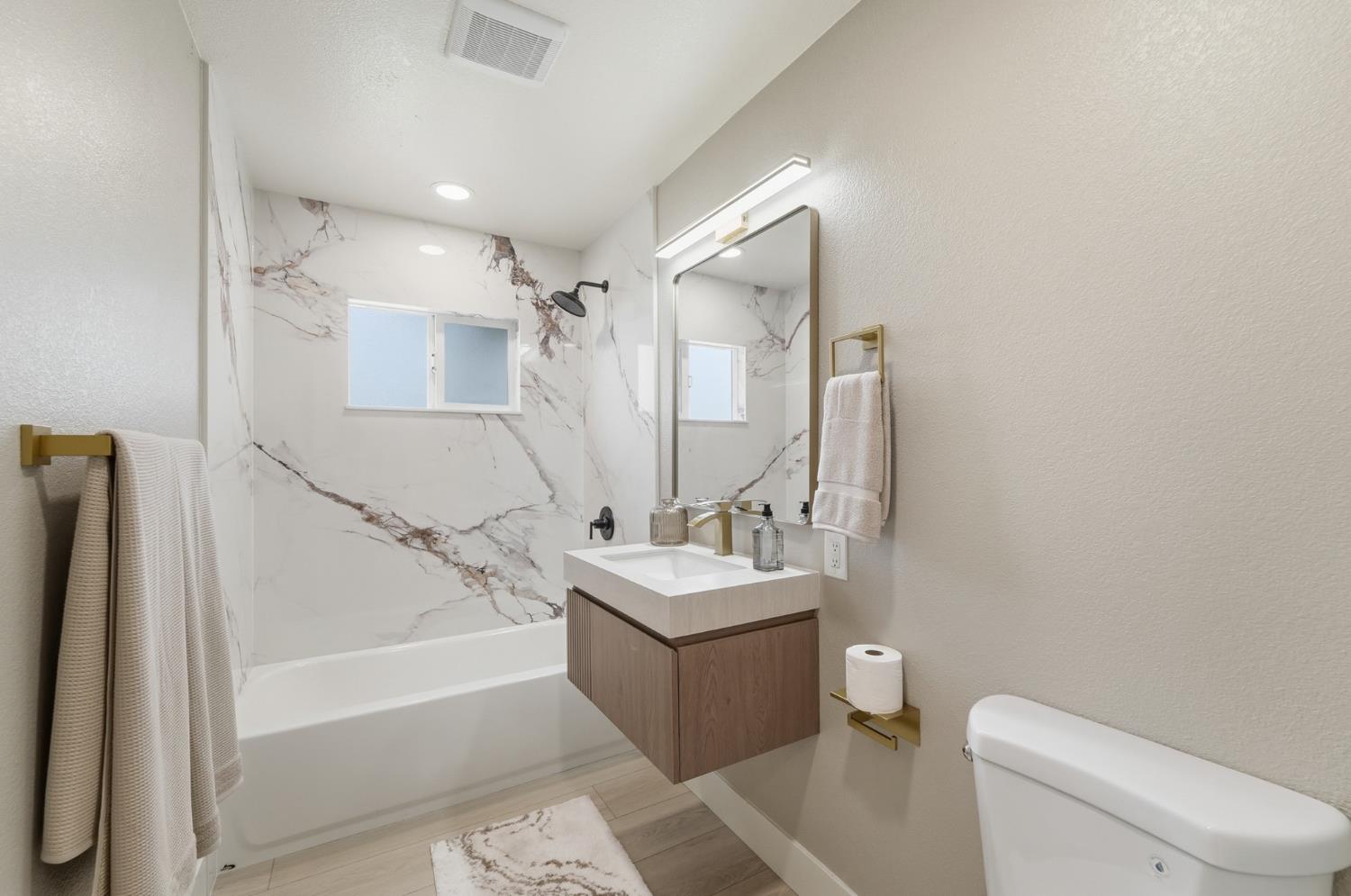 6237 Claus Road Riverbank, CA 95367 - Photo 19 of 53 a bathroom with a sink toilet tub and shower