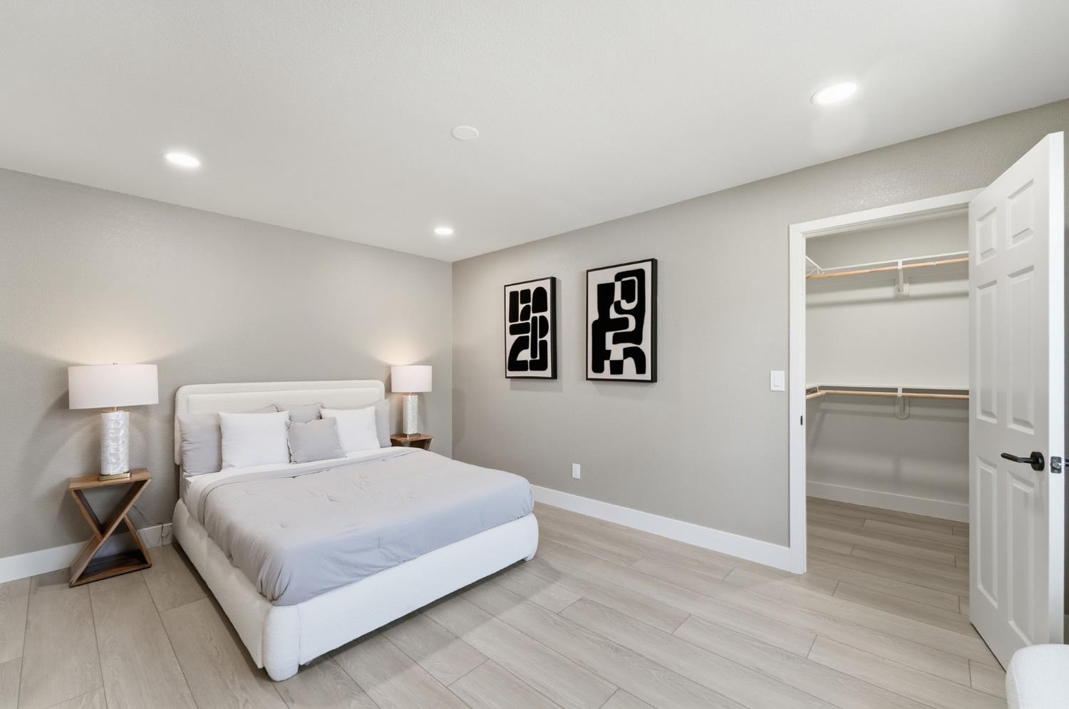 6237 Claus Road Riverbank, CA 95367 - Photo 29 of 53 a bedroom with a large bed and a night stand