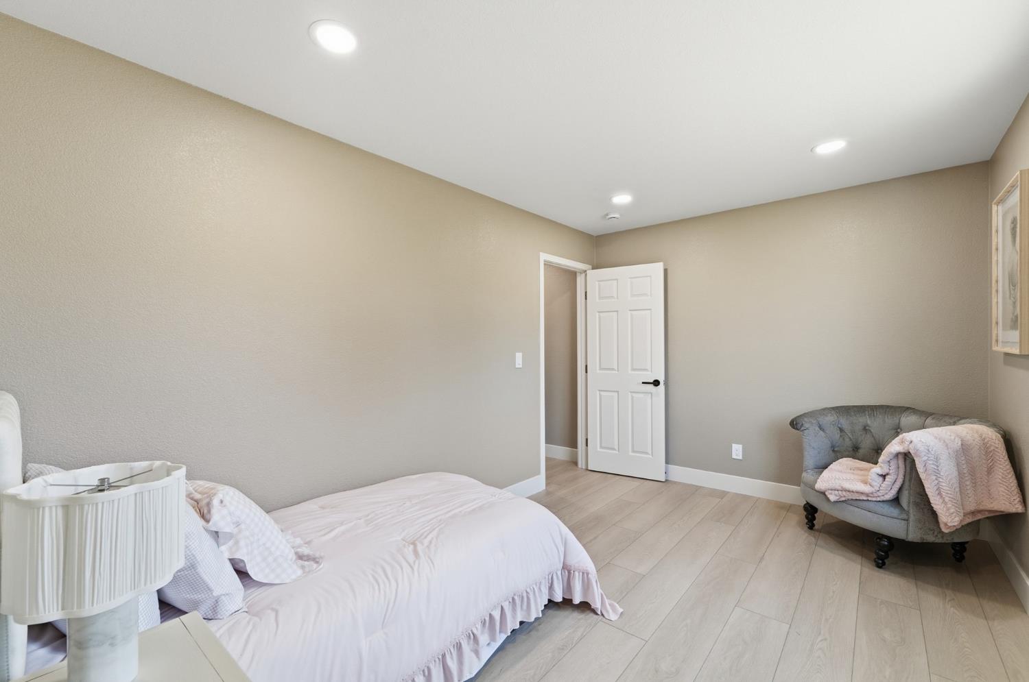6237 Claus Road Riverbank, CA 95367 - Photo 36 of 53 a spacious bedroom with a bed and a couch