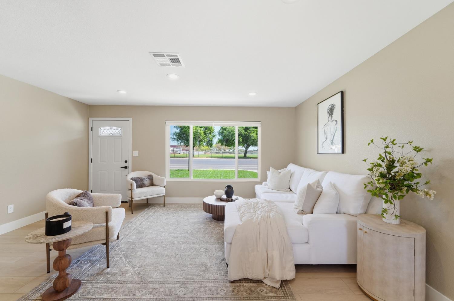 6237 Claus Road Riverbank, CA 95367 - Photo 10 of 53 a living room with furniture and a potted plant