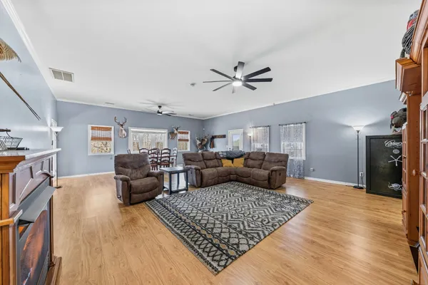 a kitchen with stainless steel appliances cabinets and a window