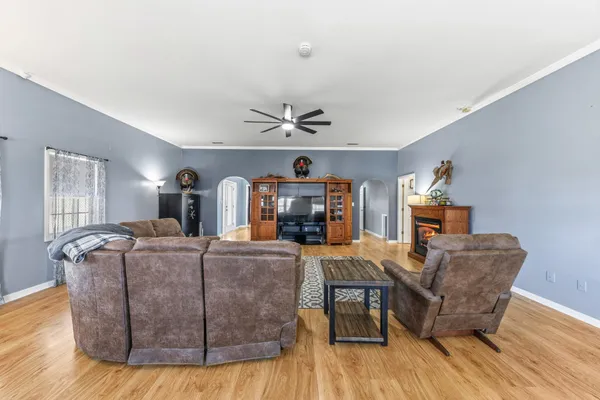 a bedroom with a large bed and a tv