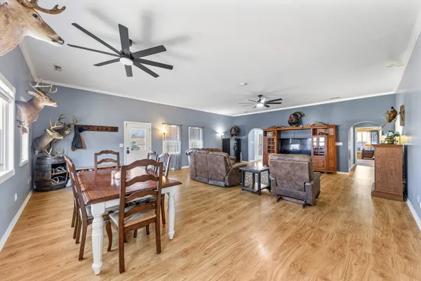 a spacious bedroom with a bed and ceiling fan