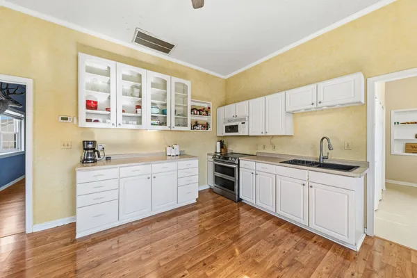 a view of a house with a yard and sitting area