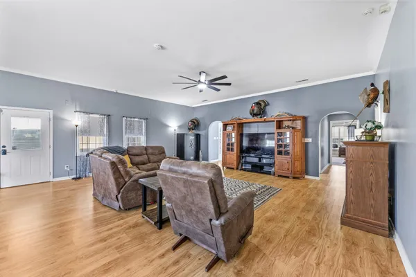 a view of a livingroom with furniture and a flat screen tv