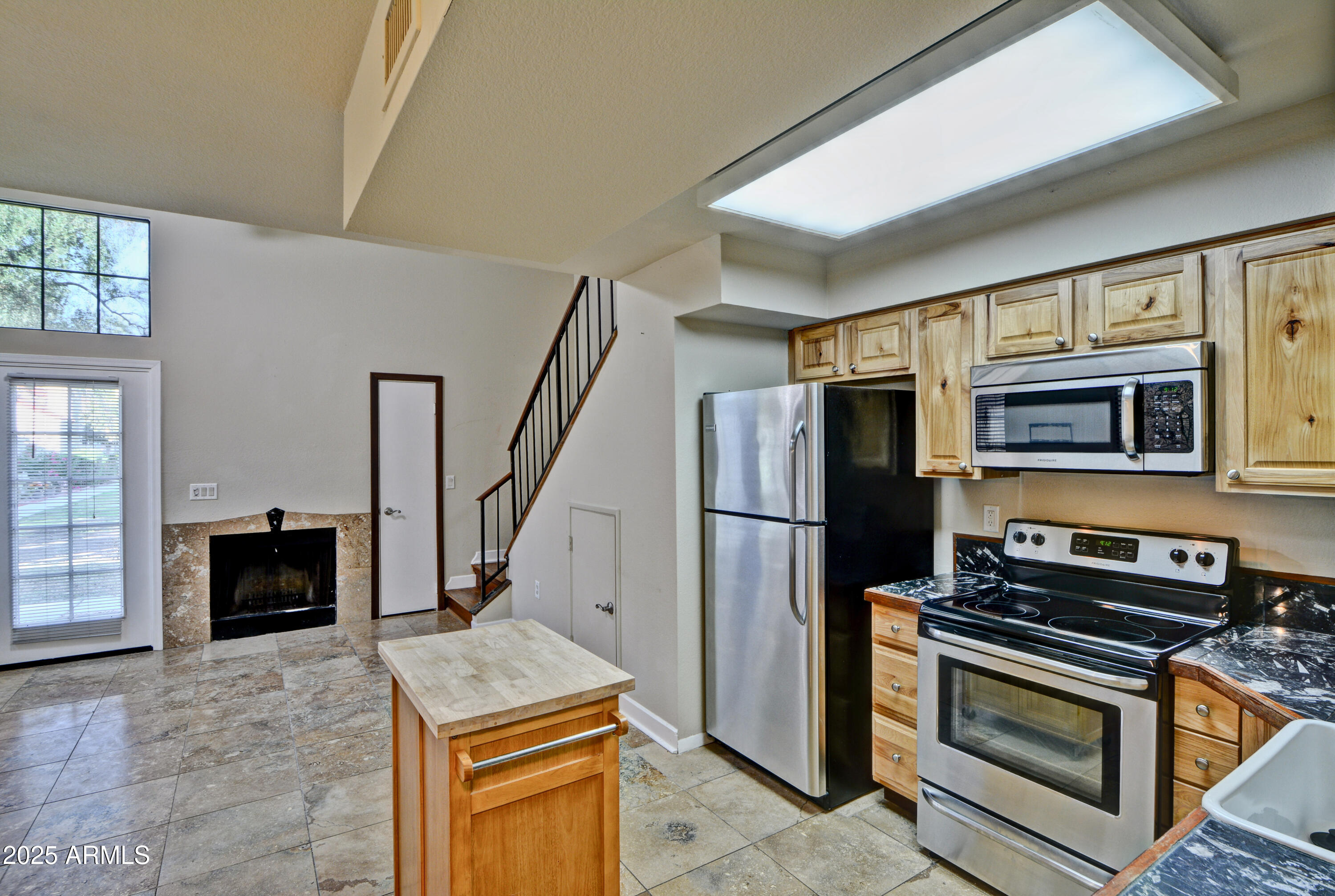 602 North May, Unit 17 Mesa, AZ 85201 - Photo 16 of 39 a kitchen with stainless steel appliances granite countertop a refrigerator stove and oven