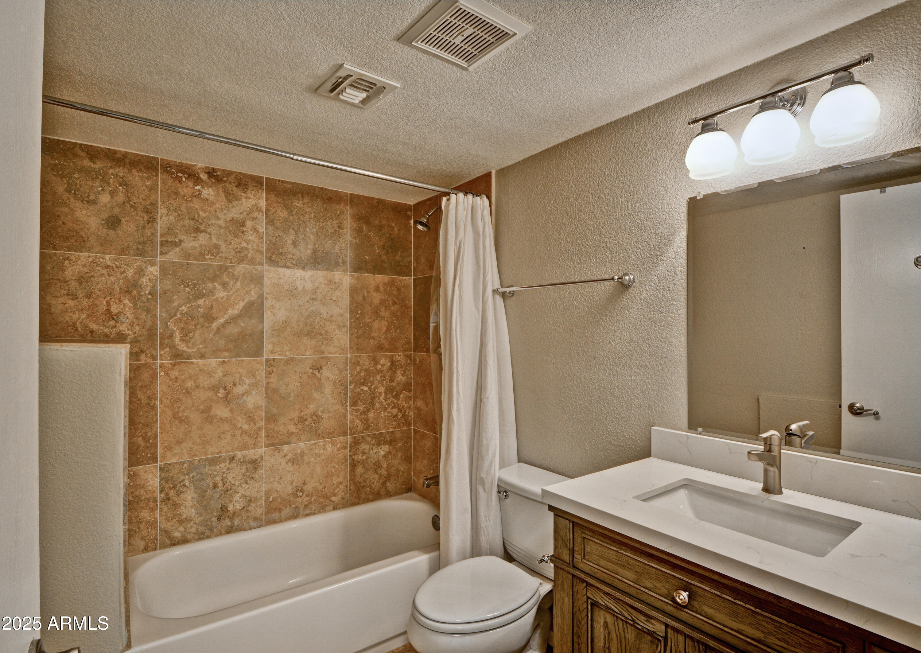 602 North May, Unit 17 Mesa, AZ 85201 - Photo 17 of 39 a bathroom with a granite countertop sink toilet and shower