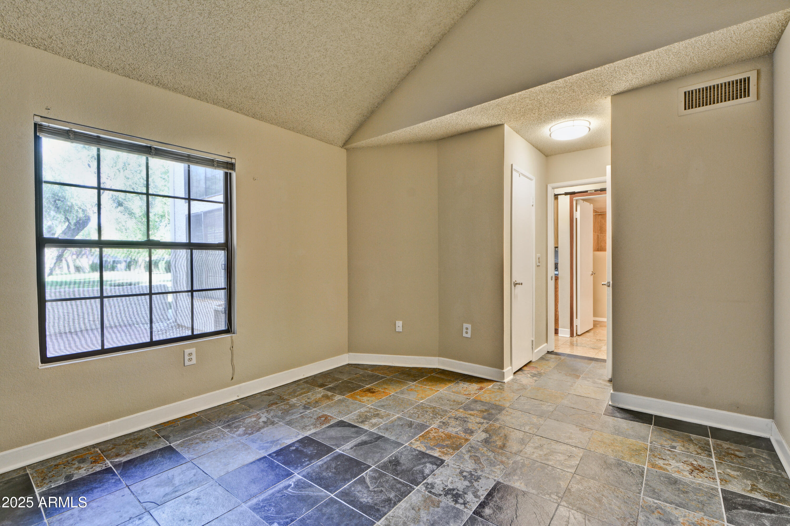 602 North May, Unit 17 Mesa, AZ 85201 - Photo 20 of 39 a view of an empty room and window