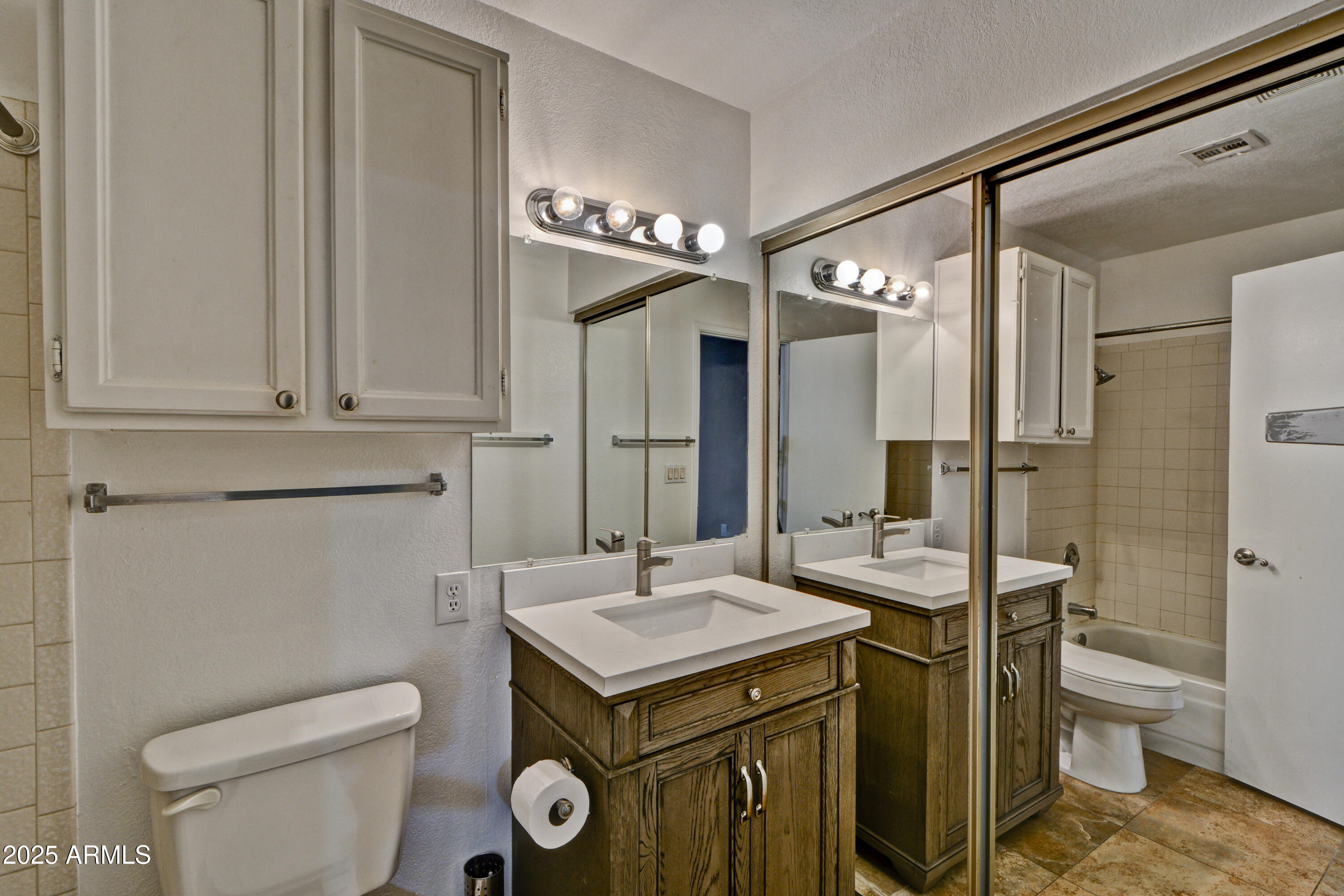 602 North May, Unit 17 Mesa, AZ 85201 - Photo 26 of 39 a bathroom with a sink a toilet and shower