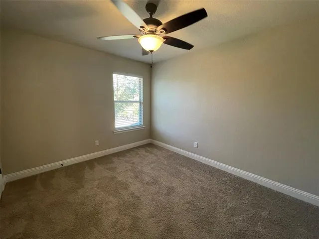 a bathroom with a granite countertop sink a mirror and a shower
