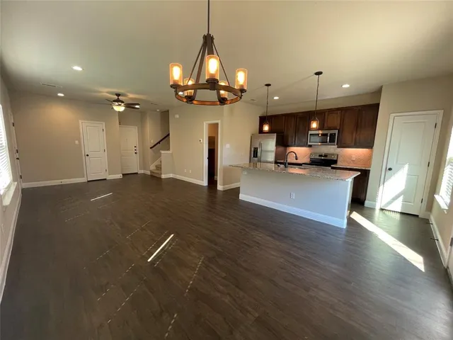 a view of a living room and kitchen