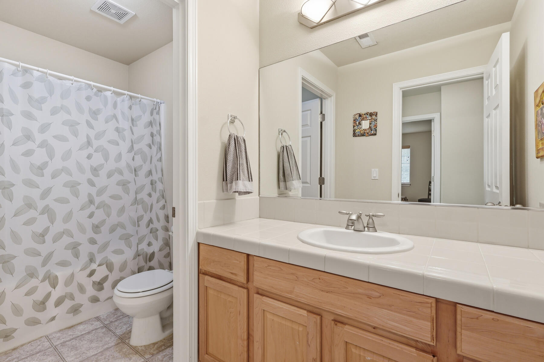 61156 Foxglove Loop Bend, OR 97702 - Photo 20 of 44 Upstairs full bathroom with separate toilet/shower room