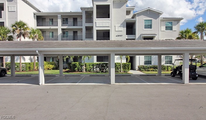 43997 Boardwalk Loop, Unit 1816 Punta Gorda, FL 33982 - Photo 15 of 44 front view of a building that has a bunch of windows