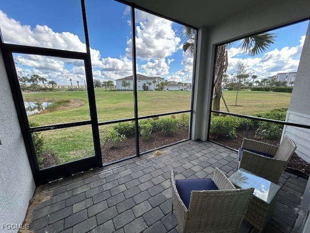 43997 Boardwalk Loop, Unit 1816 Punta Gorda, FL 33982 - Photo 2 of 44 a view of a porch with furniture and garden view