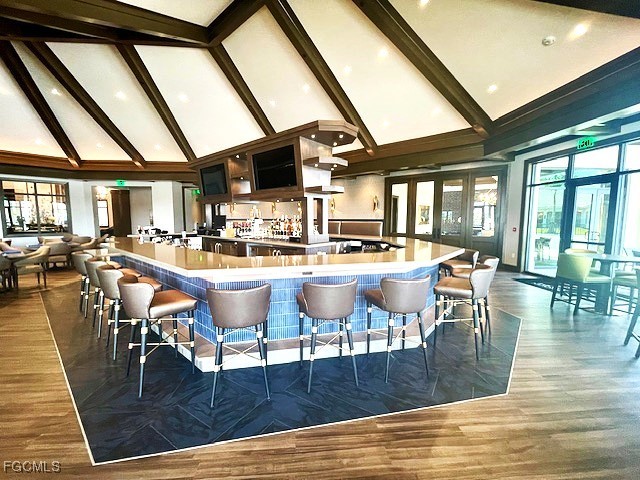 43997 Boardwalk Loop, Unit 1816 Punta Gorda, FL 33982 - Photo 27 of 44 a dining table with chairs and wooden floor