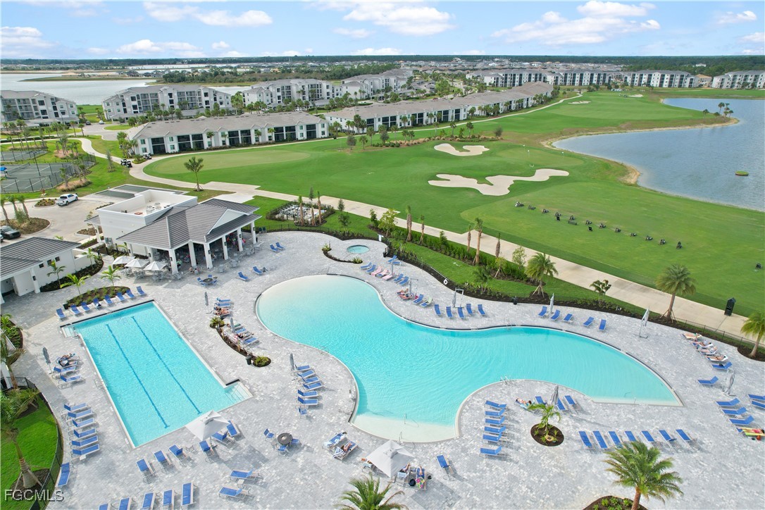 43997 Boardwalk Loop, Unit 1816 Punta Gorda, FL 33982 - Photo 29 of 44 a view of a swimming pool with a garden