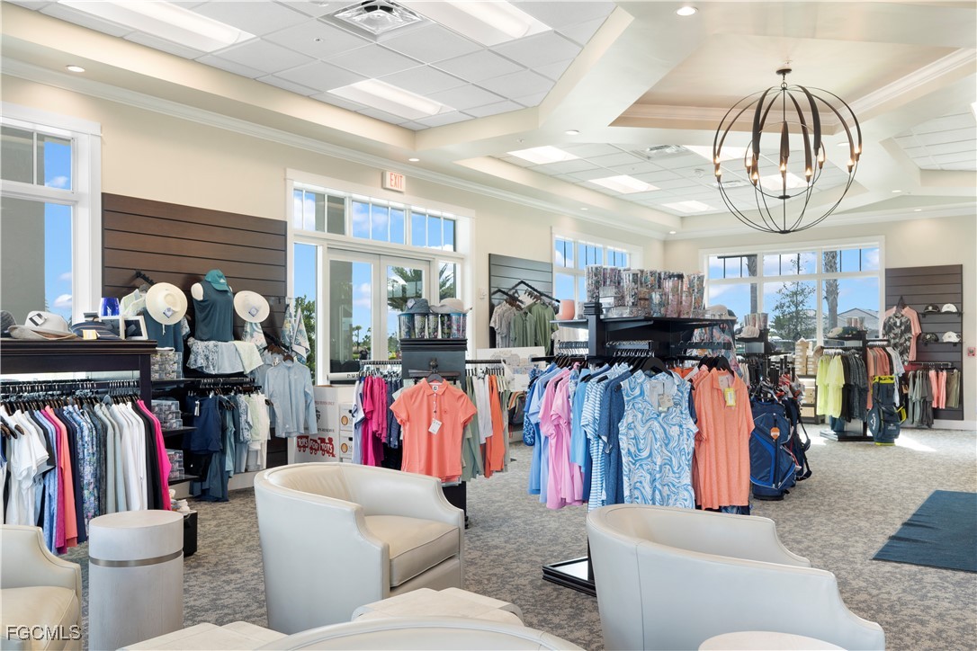 43997 Boardwalk Loop, Unit 1816 Punta Gorda, FL 33982 - Photo 30 of 44 a living room filled with lots of furniture and a chandelier