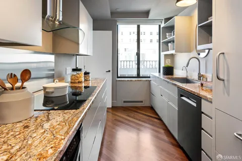 a bedroom with furniture and a large window