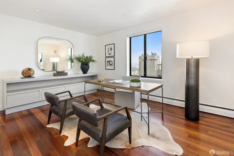 a bedroom with a bed and a lamp