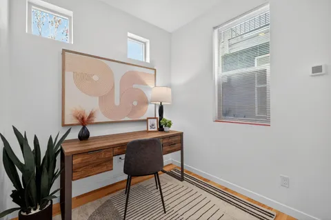 a workspace with furniture and window