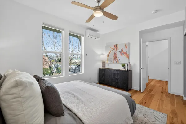 a bedroom with a bed and a window