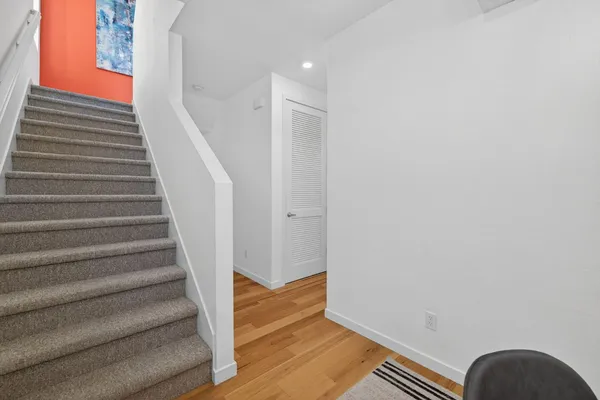a view of entryway with wooden floor