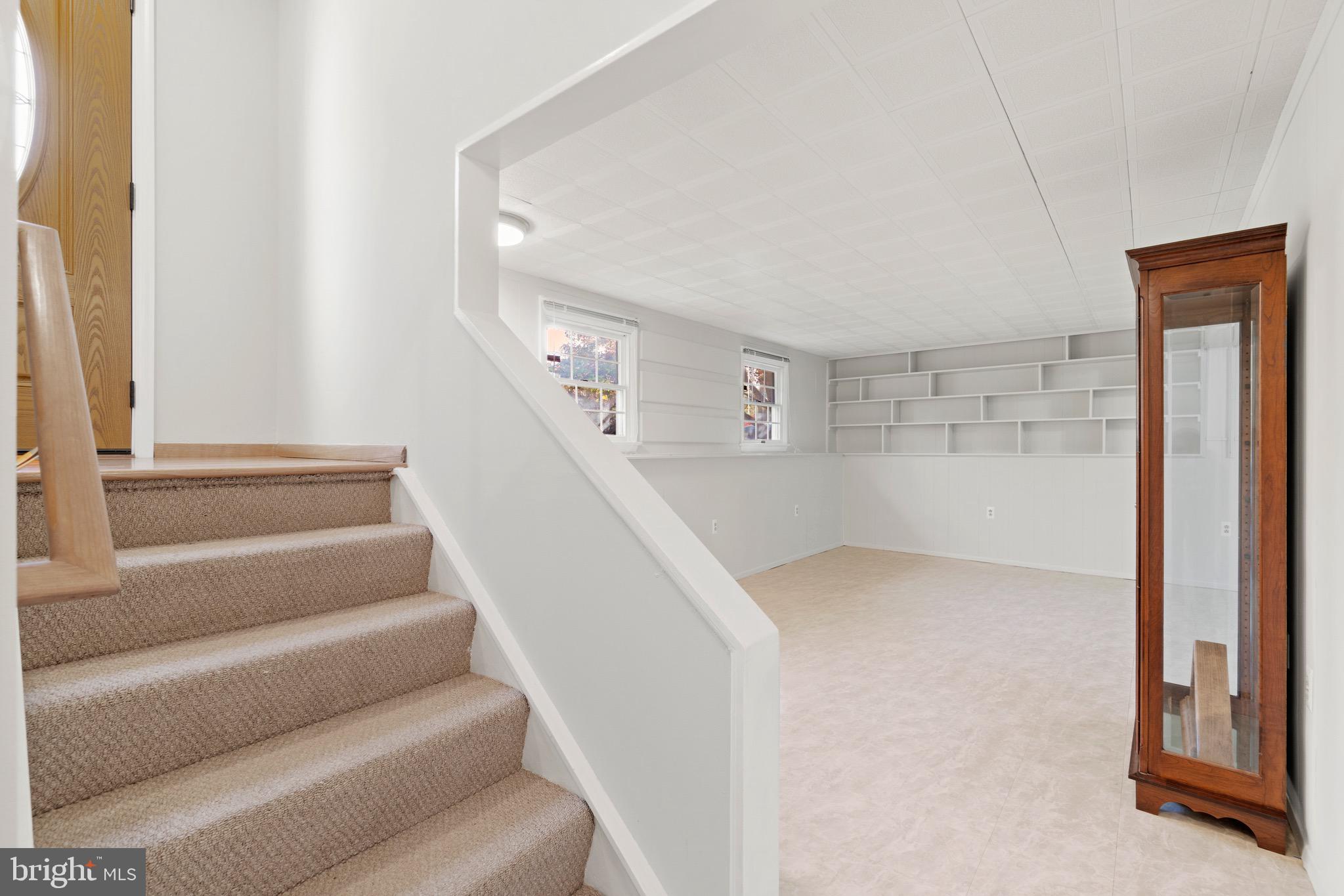 12762 Bradwell Road Herndon, VA 20171 - Photo 23 of 35 Lower level looks out big windows to front yard.