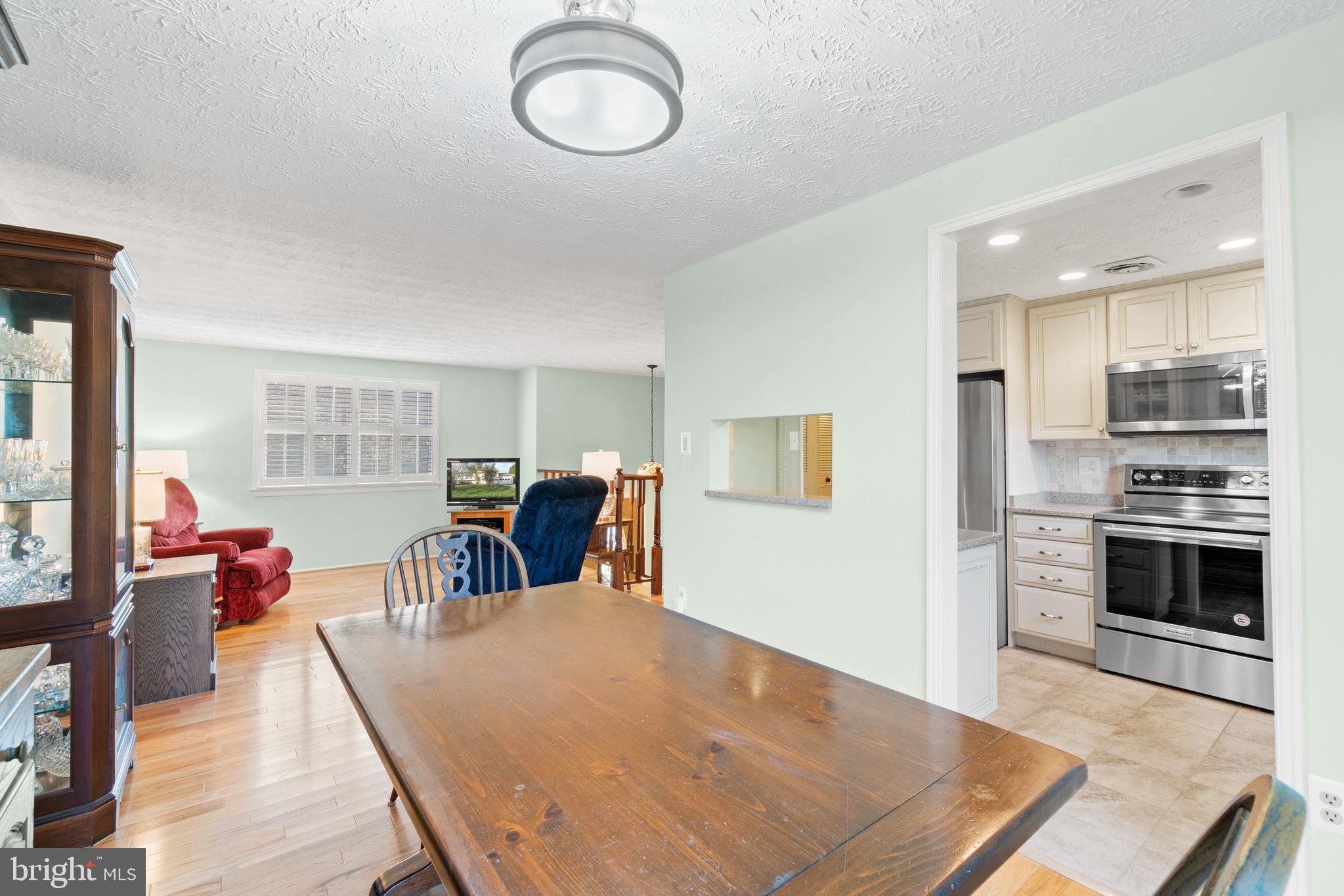 12762 Bradwell Road Herndon, VA 20171 - Photo 8 of 35 Dining room opens to kitchen & living room.