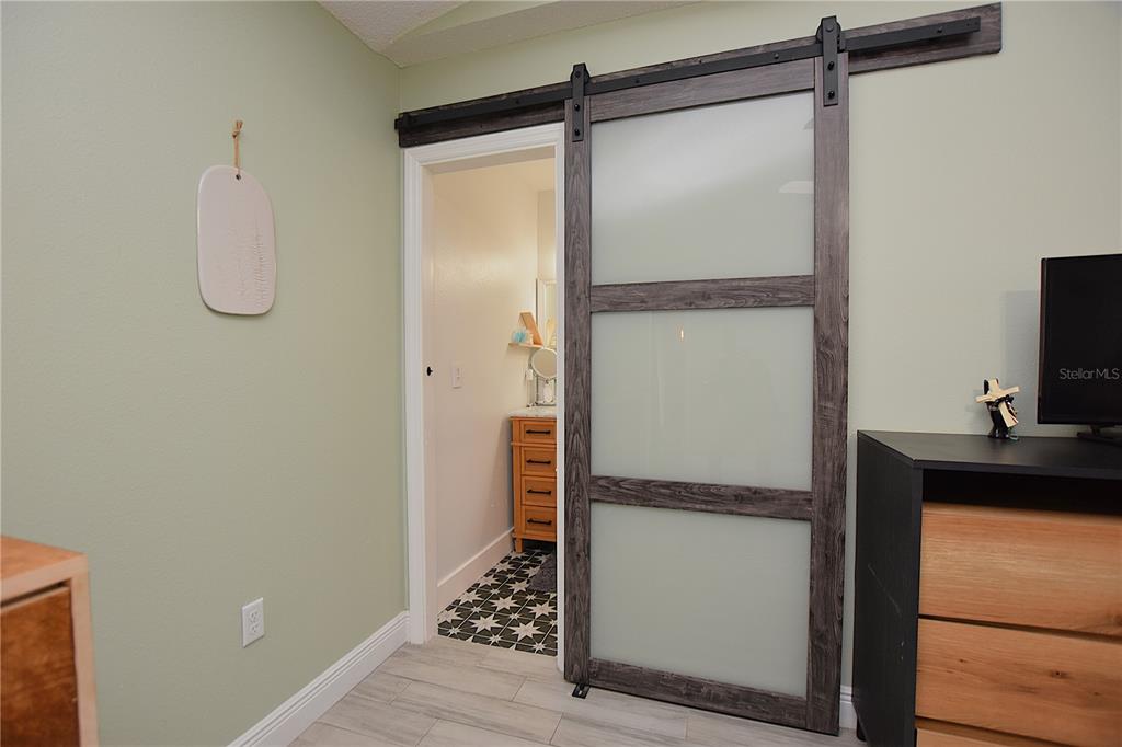 2022 Hatteras Point Lakeland, FL 33813 - Photo 18 of 36 a walk in closet and a mirror