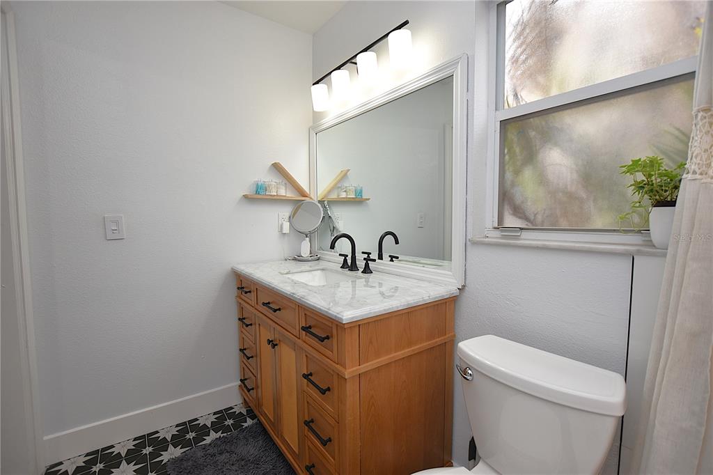 2022 Hatteras Point Lakeland, FL 33813 - Photo 22 of 36 a bathroom with a sink and a toilet