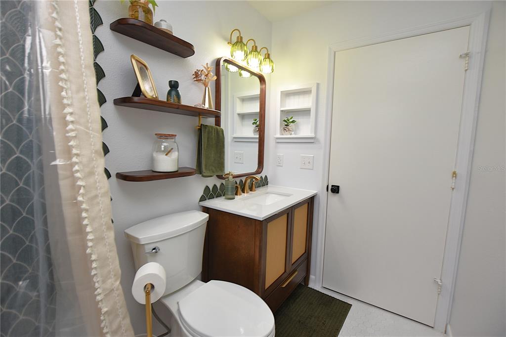 2022 Hatteras Point Lakeland, FL 33813 - Photo 27 of 36 a bathroom with a toilet sink and mirror