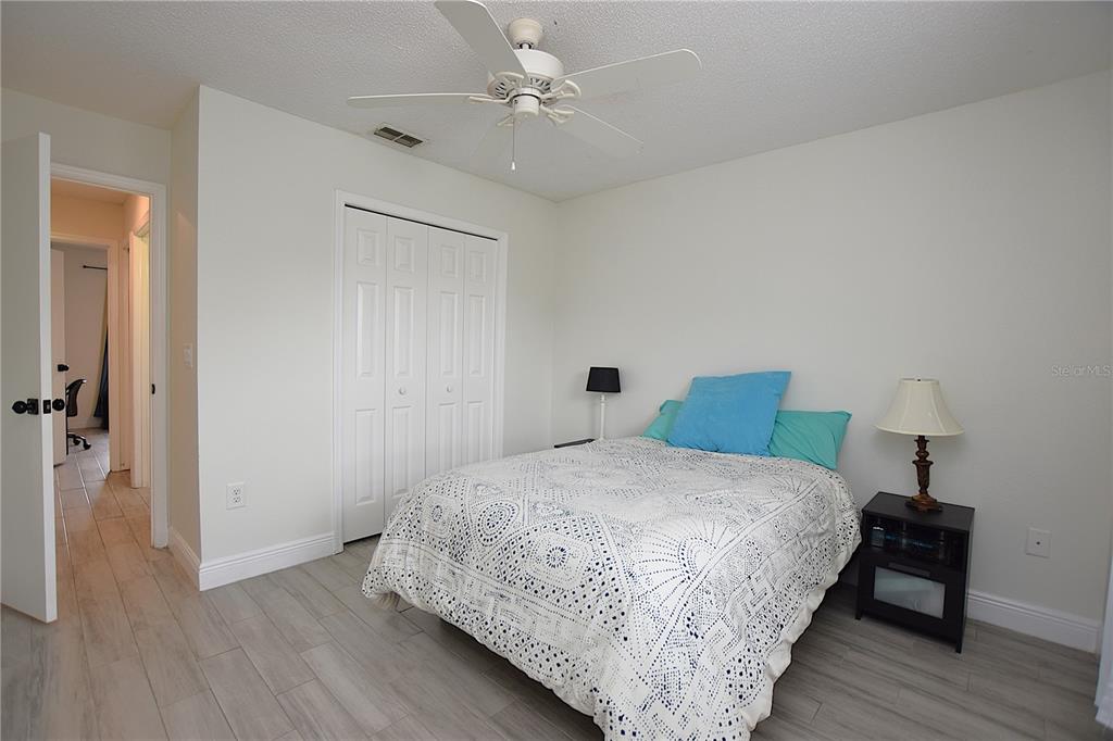 2022 Hatteras Point Lakeland, FL 33813 - Photo 28 of 36 a bedroom with a bed and a table