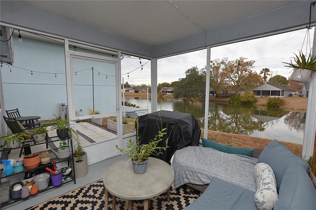 2022 Hatteras Point Lakeland, FL 33813 - Photo 30 of 36 a living room with patio furniture and a potted plant