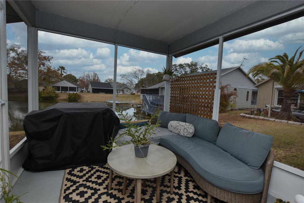 2022 Hatteras Point Lakeland, FL 33813 - Photo 31 of 36 a living room with furniture fireplace and a floor to ceiling window