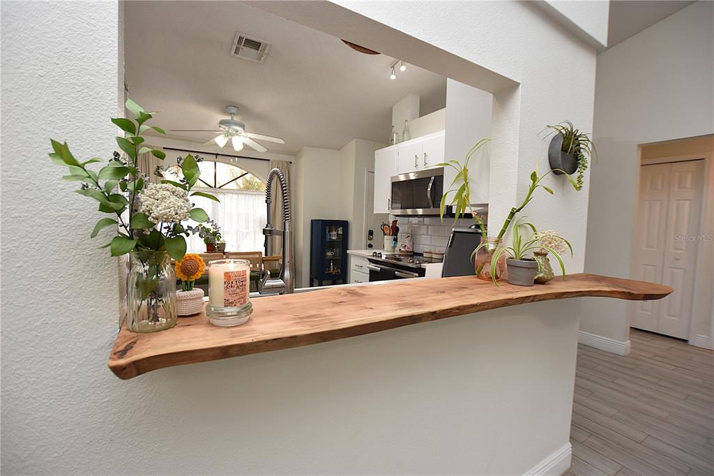 2022 Hatteras Point Lakeland, FL 33813 - Photo 10 of 36 a dining room with furniture and a floor to ceiling window