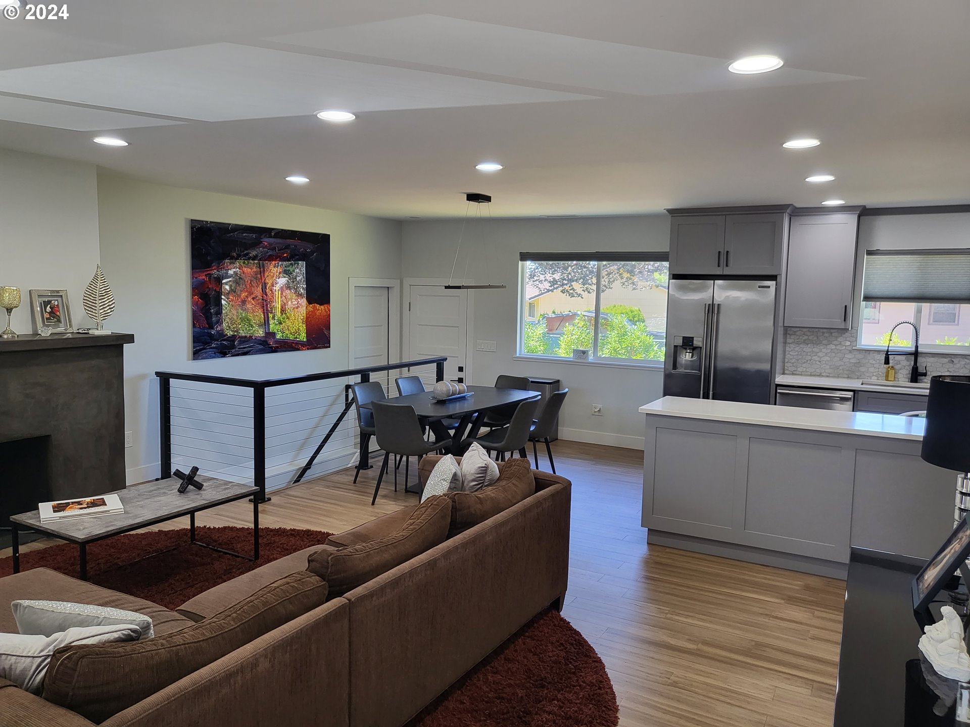 949 Southeast 221st Avenue Gresham, OR 97030 - Photo 8 of 19 a living room with furniture and a flat screen tv