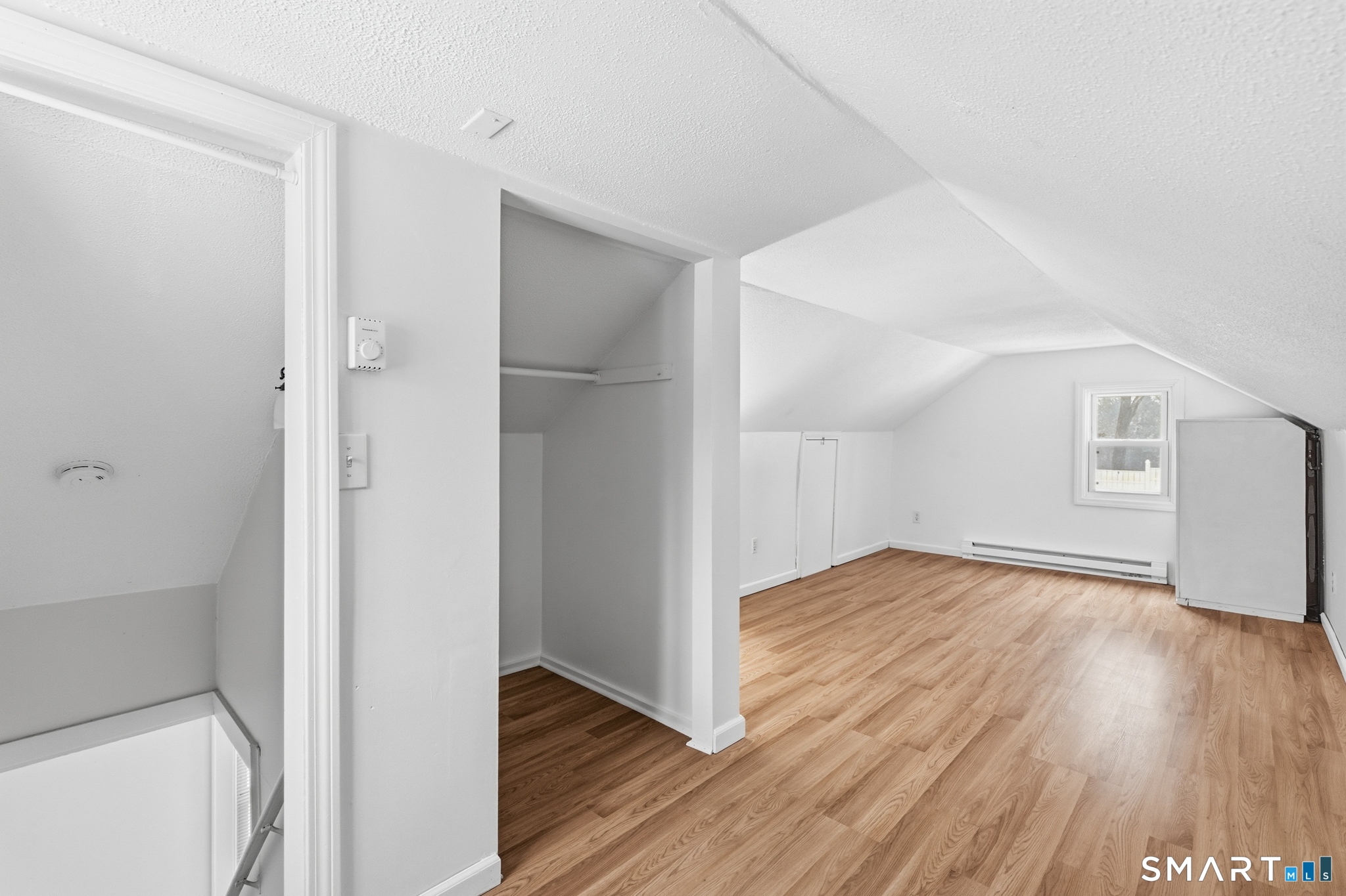 1565 Byam Road Cheshire, CT 06410 - Photo 16 of 18 a view of empty room with wooden floor and fan