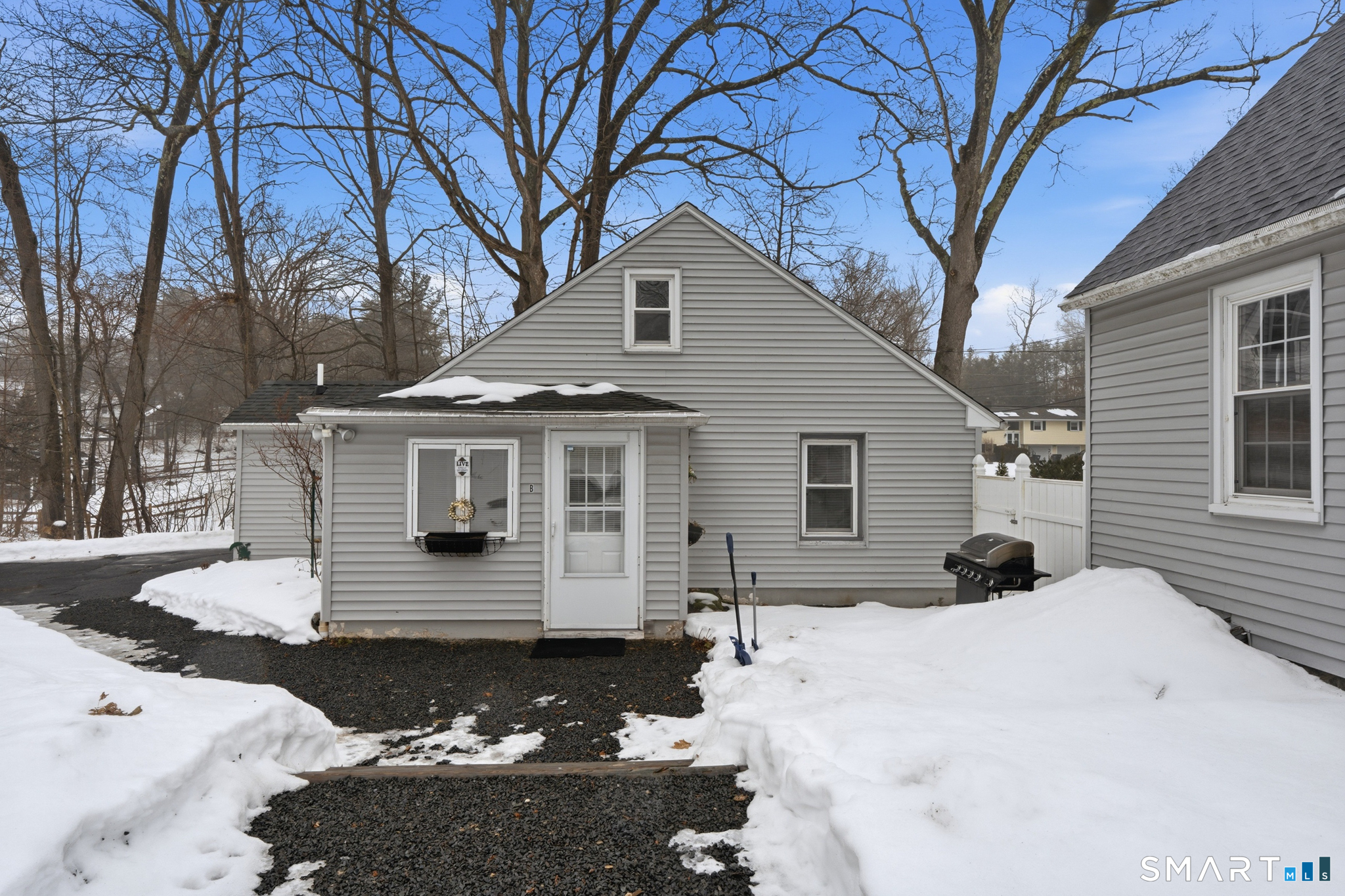 1565 Byam Road Cheshire, CT 06410 - Photo 2 of 18 a front view of a house with a yard covered with snow