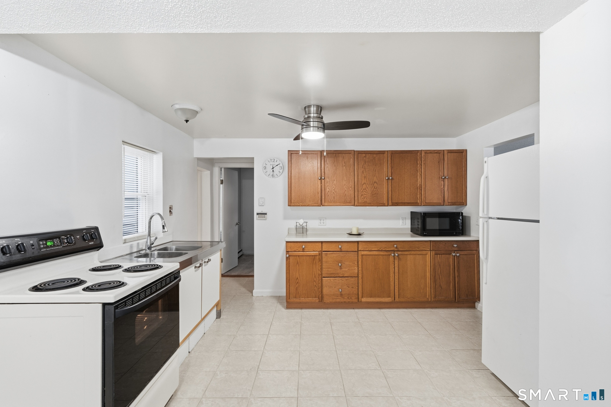 1565 Byam Road Cheshire, CT 06410 - Photo 4 of 18 a kitchen with stainless steel appliances a stove top oven and a refrigerator