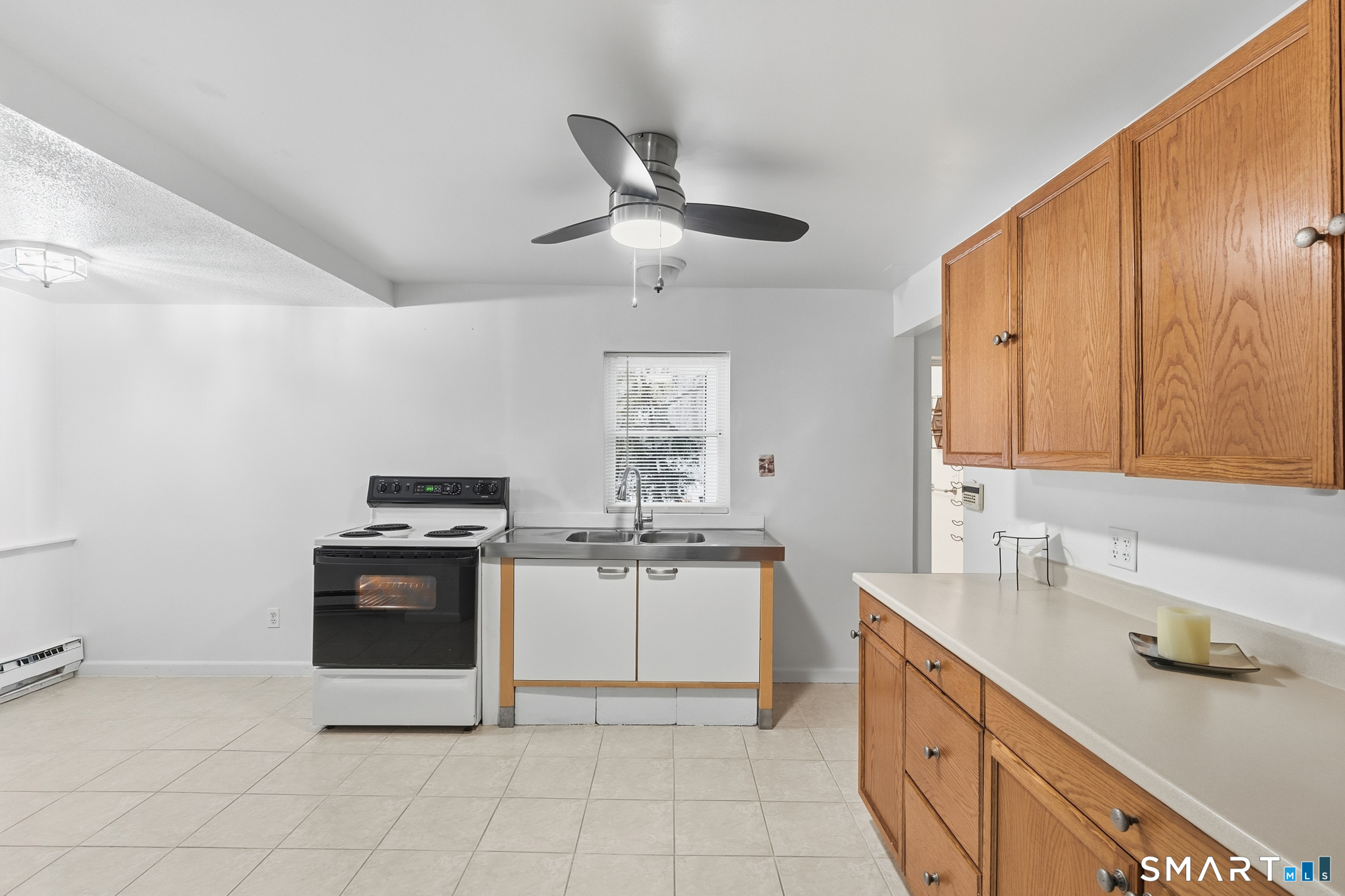 1565 Byam Road Cheshire, CT 06410 - Photo 5 of 18 a kitchen with stainless steel appliances granite countertop a stove a sink and a refrigerator
