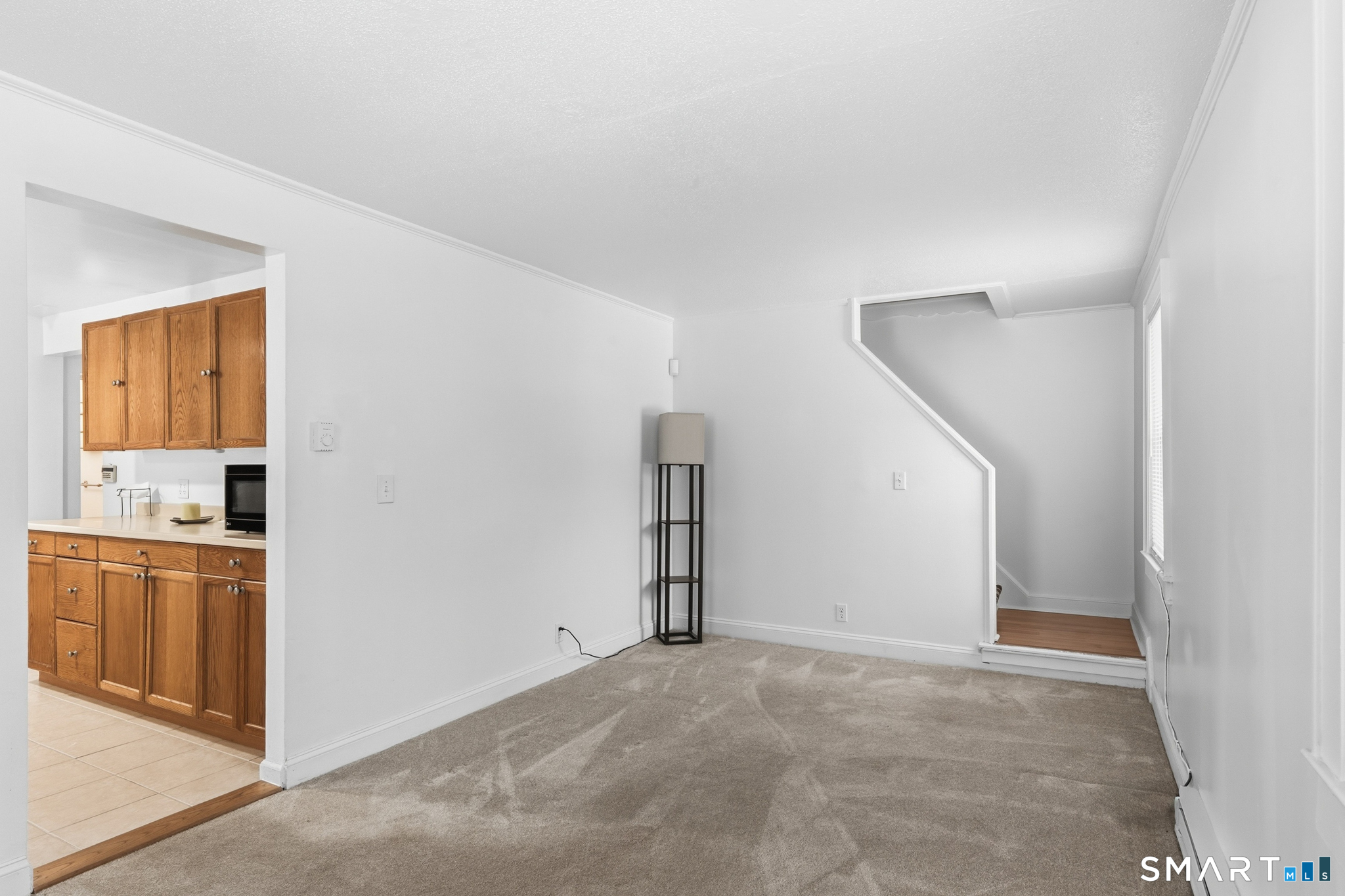 1565 Byam Road Cheshire, CT 06410 - Photo 9 of 18 a view of a kitchen with an empty space and a window